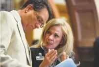  ?? Photos by Aaron Ontiveroz, The Denver Post ?? State Sen. Vicki Marble speaks with Sonnenberg before a vote at the Capitol on Thursday.