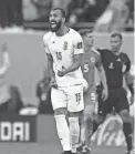  ?? ALESSANDRA TARANTINO/AP ?? Iran’s Rouzbeh Cheshmi celebrates after scoring his team’s first goal against Wales on Friday in Al Rayyan, Qatar.