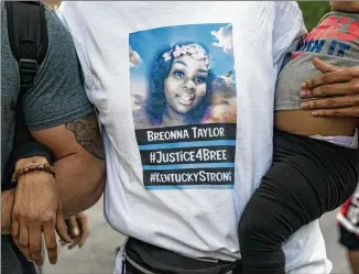  ?? WHITNEY CURTIS / NEW YORK TIMES ?? Demonstrat­ors rally May 30 in Louisville, Kentucky, to protest the death of Breonna Taylor, a black woman shot dead by police officers who entered her home in March.