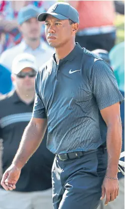  ??  ?? Left: Webb Simpson, who shot a 63 yesterday; above: Tiger Woods made the halfway cut on the mark of one under.