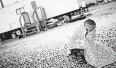  ?? Mario Tama / Getty Images ?? The kNOw Poverty Summit explores ways to solve the problem in America. This boy’s Louisiana family was still living in a FEMA trailer long after Hurricane Katrina.