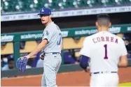  ?? DAVID J. PHILLIP/ASSOCIATED PRESS ?? Dodgers relief pitcher Joe Kelly, left, taunts Houston’s Carlos Correa after striking him out to end the sixth inning Tuesday night, prompting both benches to empty.