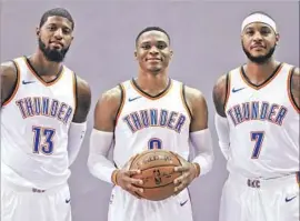  ?? Sue Ogrocki Associated Press ?? MOST VALUABLE PLAYER Russell Westbrook, center, has been joined in Oklahoma City by All-Stars Paul George, left, and Carmelo Anthony.