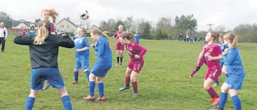  ??  ?? ● Erin Maloney (centre - maroon) scored four goals for Bethel Under-16s