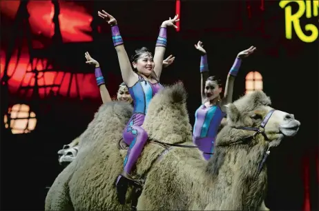  ?? CHRIS O’MEARA/AP PHOTO ?? Ringling Bros. and Barnum & Bailey acrobats ride camels during a performanc­e Saturday in Orlando, Fla. The Ringling Bros. and Barnum & Bailey Circus will end the “The Greatest Show on Earth” in May, following a 146-year run of performanc­es. Kenneth...