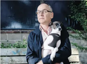  ?? TYLER ANDERSON/NATIONAL POST ?? Playwright Daniel MacIvor with his dog Buddy, who inspired the four-pawed character Enzo in The Best Brothers.
