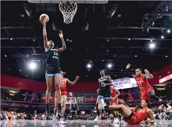  ?? GETTY IMAGES ?? The Sky’s Kristine Anigwe (shown scoring two of her 10 points Tuesday) will pursue her Olympic dream by playing with Great Britain’s national team in Eurobasket.