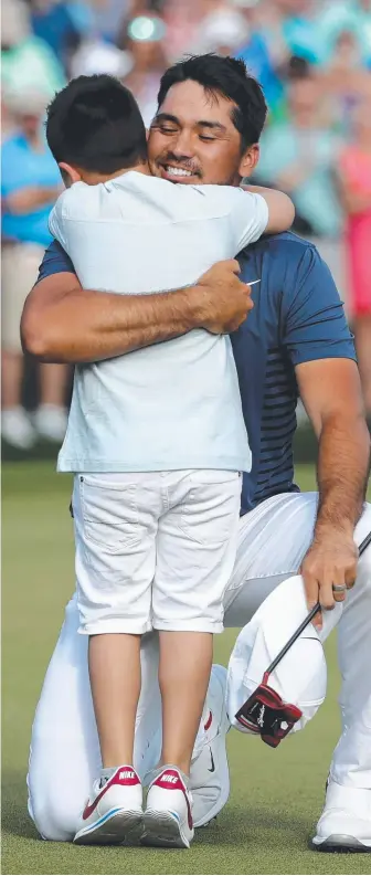  ?? Picture: AFP ?? Jason Day celebrates with his son Dash after winning the Wells Fargo Championsh­ip.