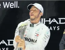  ?? |
Reuters ?? MERCEDES’ Lewis Hamilton celebrates his Abu Dhabi Grand Prix win on the podium yesterday.