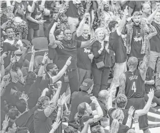  ?? Michael Ciaglo / Houston Chronicle ?? Rockets forward P.J. Tucker, right, celebrates a 3-pointer during a playoff game at Toyota Center. The Rockets say the loud home crowd gave the players a boost against the Jazz in Game 5.