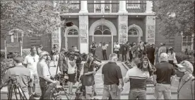  ?? Travis Long/the News & Observer/tns ?? Reporters and photograph­ers gather outside the Pasquotank County Courthouse in Elizabeth City on Wednesday before a hearing on the release of Pasquotank County Sheriff’s deputies’ body camera video from the shooting death of Andrew Brown Jr.