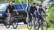  ?? Reuters ?? US President Joe Biden, along with First Lady Jill Biden, takes a bike ride in Rehoboth Beach, Delaware yesterday.