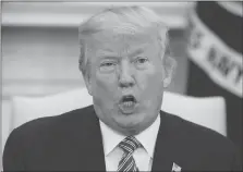  ??  ?? President Donald Trump speaks during a meeting with campaign volunteer Shane Bouvet, in the Oval Office of the White House on Friday in Washington.