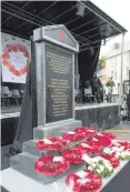  ??  ?? Wreaths laid at the memorial to the victims of Enniskille­n bomb