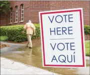  ?? REANN HUBER / REANN.HUBER@AJC.COM ?? Gwinnett County residents take part in primary election voting at the Duluth Festival Center on May 22.