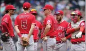  ?? TED S. WARREN — THE ASSOCIATED PRESS ?? Angels manager Phil Nevin, center, hasn’t been able to right the ship after taking over for Joe Maddon in early June.