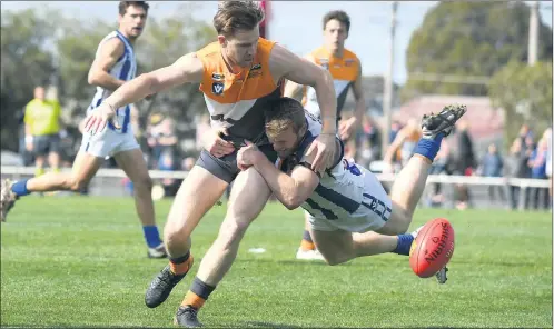  ??  ?? FIERCE: Southern Mallee Giants player Jackson Fisher gets caught up in a desperate tackle from Harrow-balmoral assistant coach Nick Pekin during a Horsham District football grand final. Picture: PAUL CARRACHER