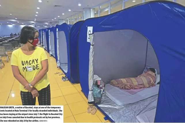  ?? NONIE REYES ?? ANAJEAN GRETA, a native of Bacolod, stays at one of the temporary tents located at Naia Terminal 3 for locally stranded individual­s. She has been staying at the airport since July 7. Her flight to Bacolod City on July 8 was canceled due to health protocols set by her province. She was rebooked on July 24 by her airline.