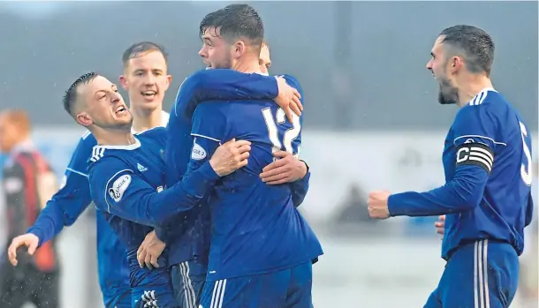  ??  ?? OUTSTANDIN­G: Cove Rangers defender Daniel Higgins celebrates scoring the equaliser in a vital game which saw his side win 2-1 over rivals Edinburgh City at Balmoral