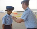  ??  ?? Medicine Hat's newest Air Cadet pilots receive their wings at the special Power Point Scholarshi­p Wings Parade at Super T Aviation Thursday night.
Cadet Anoushka Gaekwad of the 15 Medicine Hat Air Cadet Squandron receives her pilot wings from...