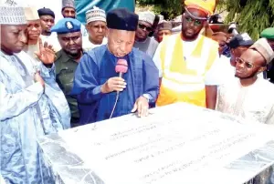  ?? ?? Governor Masari at the flag-off of constructi­on of 75 new schools