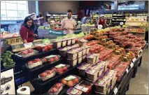  ?? NAM Y. HUH — THE ASSOCIATED PRESS ?? U.S. demand for grocery delivery is cooling as food prices rise. Some shoppers are shifting to less expensive grocery pickup, while others are returning to the store, causing some turmoil in the delivery industry.