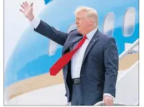  ?? "1 1)050 ?? U.S. President Donald Trump waves after arriving on Air Force One at Miami Internatio­nal Airport in Miami Friday.