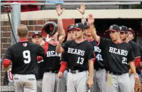  ?? AUSTIN HERTZOG — DIGITAL FIRST MEDIA ?? Boyertown’s Austyn Levengood (9) is congratula­ted by teammates after scoring a run against Phoenixvil­le in the PAC championsh­ip game Friday at Boyertown.