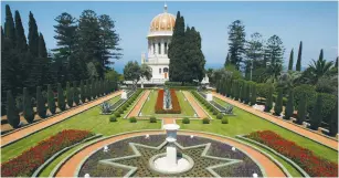  ?? (Baz Ratner/Reuters) ?? THE GOLD-ENAMELED dome of the Baha’i shrine sits among tranquil, terraced gardens above Haifa.