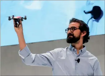  ?? WANG YING / XINHUA ?? Michael Perry, director of strategic partnershi­ps at drone-maker DJI, introduces the new 1-pound Spark at a press event in New York City on Wednesday.