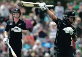  ?? Picture: AP PHOTO, MARK BAKER ?? THIS BAT WEIGHS A TON: Ross Taylor celebrates after scoring his century at the Hagley Oval yesterday.