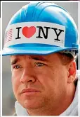  ?? GETTY, AP ?? Milton Glaser in later life, and above, a New York firefighte­r wearing a helmet with Glaser’s slogan at a memorial service after the 9/11 terrorist attacks.