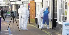  ?? Picture: Andy Clark ?? Forensics officers at the scene of the murder