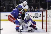  ?? ADAM HUNGER — THE ASSOCIATED PRESS ?? New York Rangers goaltender Igor Shesterkin stops a shot by Pittsburgh Penguins center Sidney Crosby (87) during the third period in Game 7of a first-round playoff series Sunday in New York.