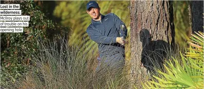  ?? PICTURE: GETTY ?? Lost in the wilderness: McIlroy plays out of trouble on his opening hole