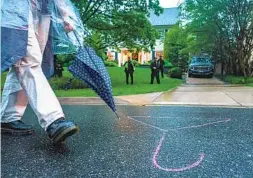  ?? CRAIG HUDSON FOR THE WASHINGTON POST ?? A hanger symbolizin­g abortion is drawn in chalk on the ground outside the home of Supreme Court Justice Brett Kavanaugh in Chevy Chase, Md.