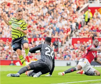  ?? | EPA ?? ARSENAL’S Leandro Trossard scored the winning goal against Manchester United at Old Trafford last night as the Gunners returned provisiona­lly to the top of the standings.