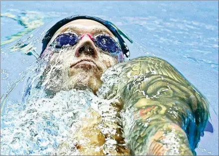  ?? OLI SCARFF/AFP ?? The US’ Caeleb Dressel warms-down after the final of the men’s 100m butterfly event during the swimming competitio­n at the 2019 World Aquatics Championsh­ips at Nambu University Municipal Aquatics Centre in Gwangju, South Korea, on Sunday.