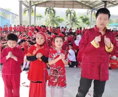  ??  ?? (From left) Year 1 pupil Ishmael Isaac Sito Rong Mohamad Ishan, Syazza Qaisara Suhardi and Erica Tiong from Year 2, and Year 5 Special Education Integratio­n Programme pupil Mike Wong pose in their traditiona­l attire.