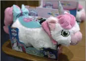  ??  ?? A battery-lighted unicorn plush toy has small felt-like accessorie­s that if removed pose ingestion hazards.