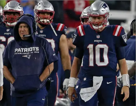  ?? MATT STONE / HERALD STAFF FILE ?? ANOTHER YEAR TOGETHER: Patriots head coach Bill Belichick and quarterbac­k Mac Jones roam the sidelines during the second half against the Tampa Bay Buccaneers at Gillette Stadium on Oct. 3.