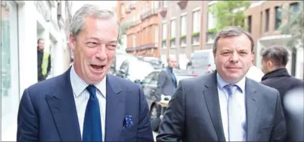  ?? JUSTIN TALLIS/AFP ?? Then-UK Independen­ce Party leader Nigel Farage (left) and Brexit donor Arron Banks leave the party’s head office in central London on May 15, 2015.