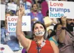  ?? LIPO CHING/STAFF ?? Wisconsin delegate Angie Aker taped her mouth closed in protest over what she said were DNC orders that the delegates in the hall show unity.