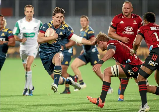  ?? GETTY IMAGES ?? With a hop, skip and a jump, Highlander­s wing Connor Garden-Bachop hares up field during his team’s shock win over the defending champion Crusaders in Christchur­ch last night.