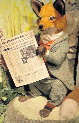  ??  ?? Mr Tod relaxes with the Woodland Gazette at The Beatrix Potter Museum