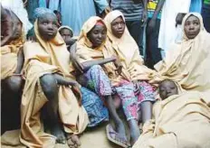  ?? Reuters ?? Some of the newly released Dapchi schoolgirl­s in Jumbam village, Yobe State, after they were set free by militants.