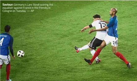  ??  ?? Saviour: Germany’s Lars Stindl scoring the equaliser against France in the friendly in Cologne on Tuesday. — AP