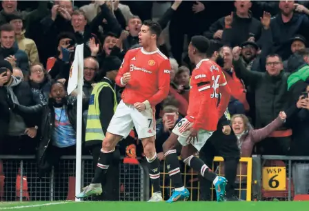  ?? AFP ?? On top:
Manchester United’s Portuguese striker Cristiano Ronaldo celebrates after scoring his and his side’s third goal in the English Premier League match against Tottenham Hotspur at Old Trafford in Manchester.