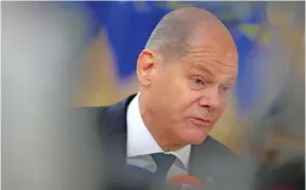  ?? AP PHOTO/VIRGINIA MAYO ?? Germany’s Chancellor Olaf Scholz speaks with the media Thursday as he arrives for an EU summit at the European Council building in Brussels, Belgium.