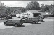  ?? NWA Democrat-Gazette/ANDY SHUPE ?? Fayettevil­le Fire Department vehicles sit Aug. 17 at the current Fire Prevention Bureau at 833 N. Crossover Road. The ambulance authority executive committee is in the process of purchasing the structure for use as a station for Central EMS after the...